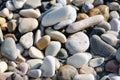 Sea gravel shore or beach at sunset