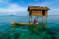 The sea gypsy on the hand carved canoe in Tetagan Island Semporna Sabah Malaysia Royalty Free Stock Photo