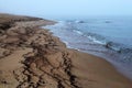 The fog, but the sea has receded and left inimitable patterns. Royalty Free Stock Photo