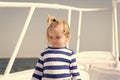 Sea is his vocation. Baby boy enjoy vacation cruise ship. Child cute sailor yacht sunny day. Boy adorable sailor striped Royalty Free Stock Photo