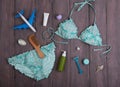 Sea holidays / travel concept - blue beautiful swimsuit, airplane and accessories: wooden hairbrush, sunscreen, bottles with cream Royalty Free Stock Photo