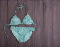 Sea holidays / travel concept - blue beautiful swimsuit in ornamen Royalty Free Stock Photo