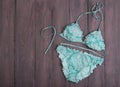 Sea holidays / travel concept - blue beautiful swimsuit in ornamen Royalty Free Stock Photo