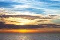 sea horizon, a beautiful evening sky with clouds, the sun is behind the clouds. Royalty Free Stock Photo