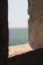 Sea and horizon line view from ancient medieval window