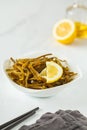 Sea kale kelp salad with oil and lemon in a white plate, white b Royalty Free Stock Photo