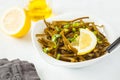Sea kale kelp salad with oil and lemon in a white plate, white b Royalty Free Stock Photo