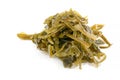 Sea kale. Seaweed kelp , on a white isolated background, close-up, selective focus. Laminari. Royalty Free Stock Photo