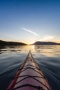 Sea Kayak paddling in the Pacific Ocean. Colorful Sunset Sky. Royalty Free Stock Photo