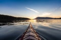 Sea Kayak paddling in the Pacific Ocean. Colorful Sunset Sky. Royalty Free Stock Photo