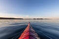 Sea Kayak paddling in the Pacific Ocean. Colorful Sunset Sky Royalty Free Stock Photo