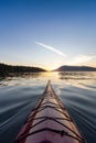 Sea Kayak paddling in the Pacific Ocean. Colorful Sunset Sky. Royalty Free Stock Photo