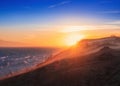 Sea or lake against the backdrop of mountains with large sand dunes during sunset. Landscape with wind on the Kapchagay reservoir Royalty Free Stock Photo