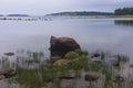 sea lake landscape stone water grass sky clouds coast north Royalty Free Stock Photo