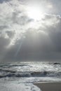 Sea landscape with huge waves and a lightbeam in Sylt Royalty Free Stock Photo