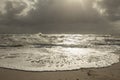 Sea landscape with huge waves and a lightbeam in Sylt