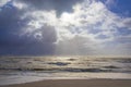 Sea landscape with huge waves and a lightbeam in Sylt Royalty Free Stock Photo