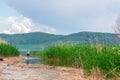 Sea landscape with mountines and canes, blue sky with clouds, cloudly without sun, kazakhstan