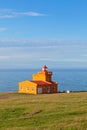 Sea Landscape with Orange Lighthouse and Blue Sky