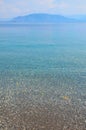 Sea landscape with pebbles and island in Turunc, Turunch Kumlubuk Mugla