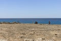 Tourists on Rocky coastline , Cape Greco on Cyprus Royalty Free Stock Photo