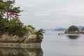 Sea landscape with several islets and a red torii gate in Matsushima, Japan. Royalty Free Stock Photo