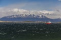 Sea landscape with a ship on great majestic snow mountains background. Beagle Channel, Ushuaia, Argentina Royalty Free Stock Photo