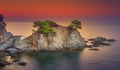 Sea landscape at sunrise. Beautiful view of cliff in Mediterranean at dawn in morning. Bright red sky over Spanish coast Royalty Free Stock Photo