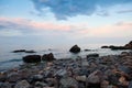 Sea landscape at sunset, stone coast and beautiful sky