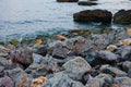 Sea landscape at sunset, stone coast and beautiful sky