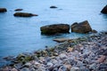 Sea landscape at sunset, stone coast and beautiful sky