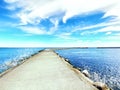 Sea landscape turquoise ocean water and blue sky with clouds sunlight panorama, nature background for summer season ,stone road to Royalty Free Stock Photo