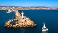 Sea lighthouse and boat at marine of port of Varna Royalty Free Stock Photo