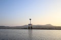 Sea at low tide with lighthouse in background