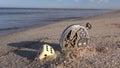 Sea and lucky time concept. Dice and old clock on beach