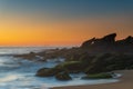 Sea Mist and Rocks, Sunrise Seascape with Fisherman Royalty Free Stock Photo