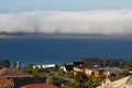 Sea mist rolling over shoreline