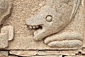 Sea monster head sandstone relief Medieval art.