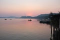 Sea and mountain at beach pier under sunset Royalty Free Stock Photo