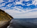 Sea, mountains, sky with clouds. Colorful landscape with love from me. Royalty Free Stock Photo