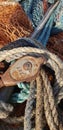 Sea net and rig, rustic sea fishing equipment. old rope and colored fishing net. fishing ship details. Detail of the machinery of