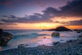 Sea Ocean. Sunrise time at the sea. Big roks. Wave hit the rock at beach, sea water splash up to the sky with sun. Sunset Royalty Free Stock Photo