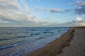 Sea. ocean. sea surface. light waves. horizon line. blue water, sandy beach and cloudy sky. Sea of Azov Royalty Free Stock Photo