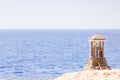 Sea or ocean view from shore with lifeguard post Royalty Free Stock Photo