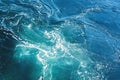 Sea or ocean waves surface texture. Abstract summer blue water background with splashes of sea foam. Royalty Free Stock Photo