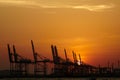 Sea oil drilling platform, sunset
