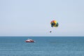 A sea parachute towed by a speedboat. Drag Boat parasailing. Royalty Free Stock Photo