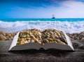 Sea with pebble beach on the pages of book