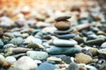 Sea pebble stones tower on beach.