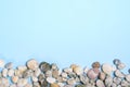 Sea Pebbles over Light Blue Background, Copy Space